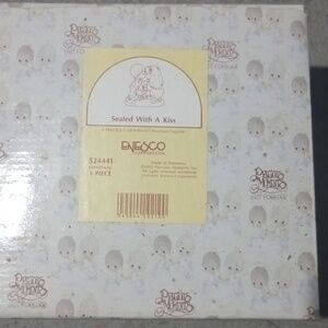 Sealed with a kiss precious moments figurine